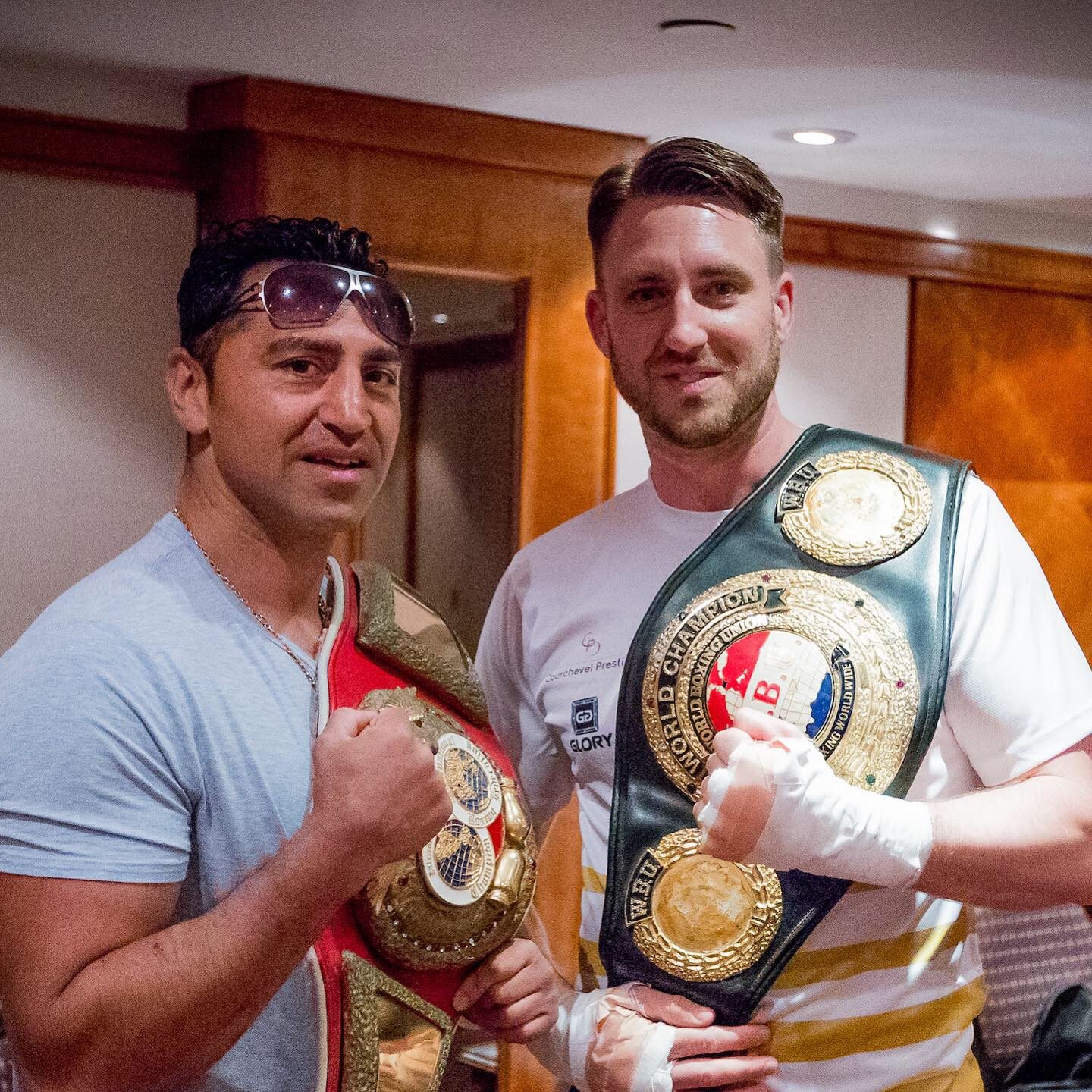 Takaloo and me with his world title belts. Only one of us earned them