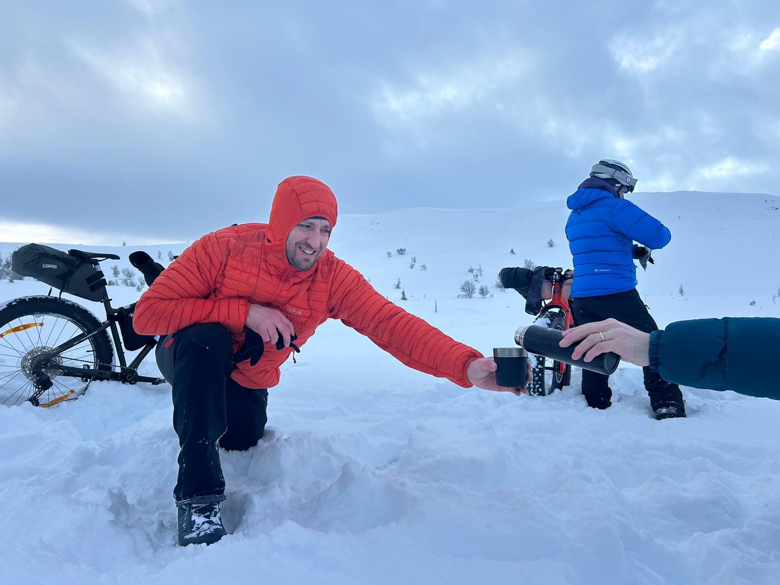 A hot drink handed over in the snow. Worth more than any medal out there